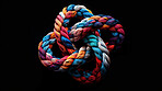 Rope, color and celtic knot with pattern, black background and texture for security, safety or strong connection. String, thread or yarn on wallpaper with abstract textile, lines and woven diversity