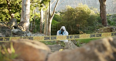 Csi, photographer and evidence at crime scene for investigation in forest with police tape and safety hazmat. Forensic quarantine, expert investigator and pictures for observation and case research