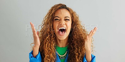 Buy stock photo Excited woman, fist pump and celebration with deal, promotion or winning on a gray studio background. Portrait of happy female person or young winner with smile in surprise for bonus on mockup space