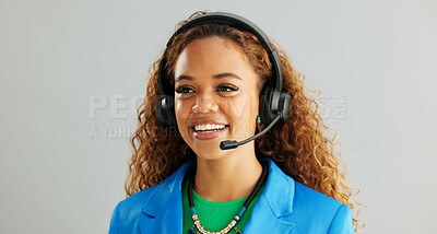 Happy woman, consultant and talking with headphones for customer service or call center on a gray studio background. Young female person or agent consulting for online advice or help on mockup space
