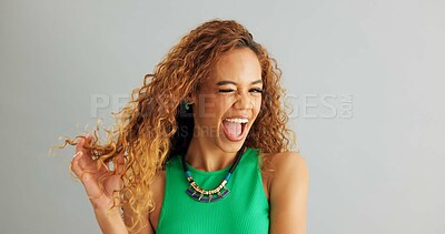 Woman, fashion and happy with hair in studio on white background, wink and necklace with trendy outfit. Closeup, female person and excited with colorful top for style, clothes and accessories