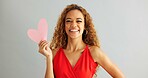 Woman, love and kiss face with paper heart for opinion, romance or thinking with ideas on grey background. Face, emoji and female person with happiness for kindness, vote or support on valentines day