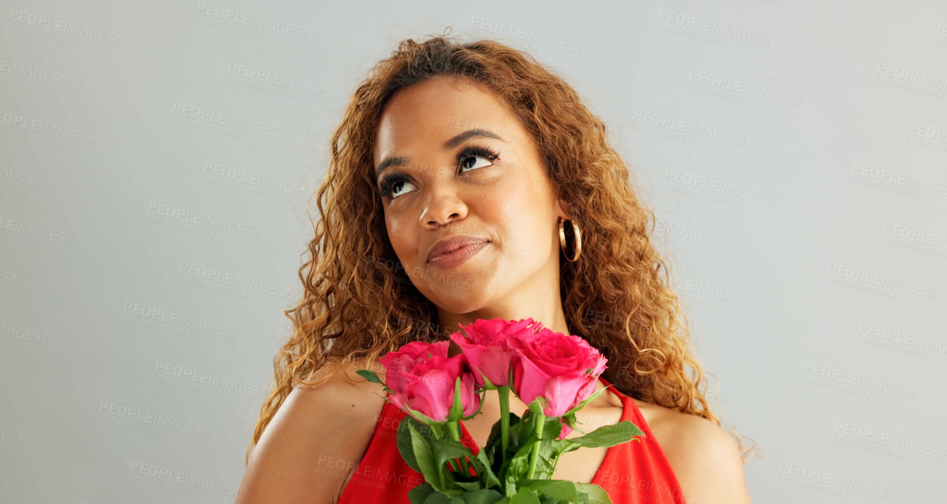 Buy stock photo Happy woman, roses and valentines day with flowers for love, care or romance on a gray studio background. Portrait of female person with smile, bouquet and plant for romantic gift on mockup space