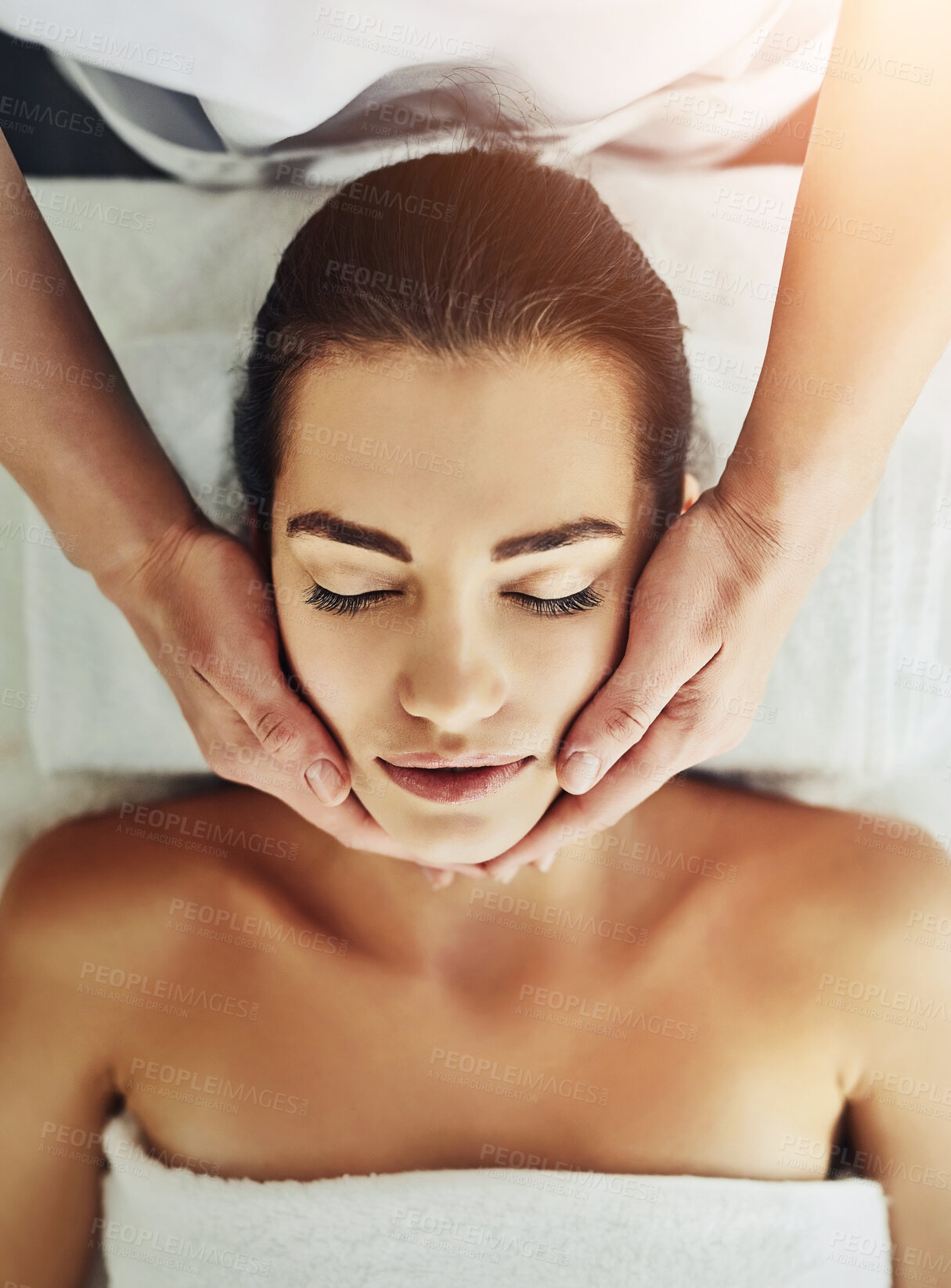 Buy stock photo Facial, head massage and hands of woman in spa for relax, calm and treatment for client on bed. Towel, face and lymphatic drainage in salon by masseuse person for stress relief for cosmetic therapy service