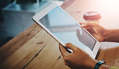 Buy stock photo Cropped shot of a businesswoman using a digital tablet at her work desk