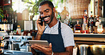 Tablet, bartender and black man on cellphone call, conversation and order alcohol stock, store delivery or inventory. Restaurant checklist, phone and business owner consulting on drinks supply chain