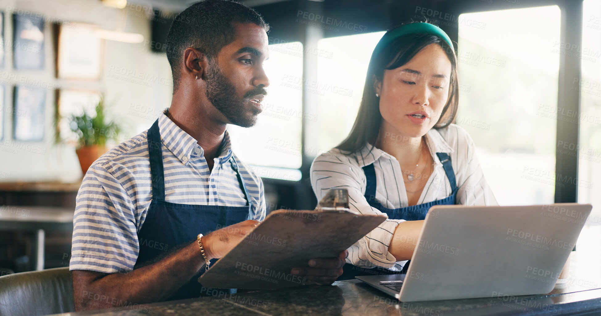 Buy stock photo Business owner, teamwork and computer for restaurant profit, sales and stock inventory management on a checklist. Man, waiter and manager with documents, laptop and planning budget in a startup cafe