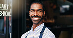 Smile, crossed arms and face of barista at cafe for welcome with positive and confident attitude. Happy, portrait and young male waiter or entrepreneur at startup coffee shop or restaurant entrance.