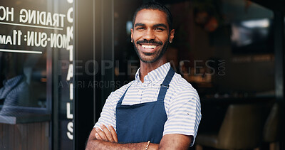 Smile, crossed arms and face of barista at cafe for welcome with positive and confident attitude. Happy, portrait and young male waiter or entrepreneur at startup coffee shop or restaurant entrance.