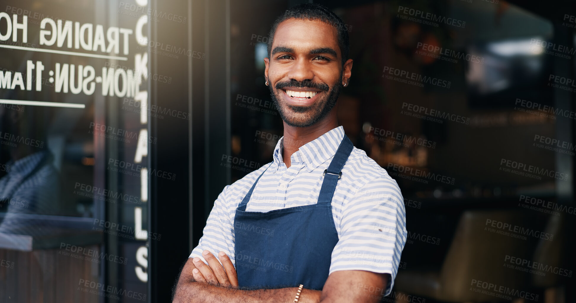 Buy stock photo Smile, crossed arms and face of barista at cafe for welcome with positive and confident attitude. Happy, portrait and young male waiter or entrepreneur at startup coffee shop or restaurant entrance.