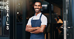 Arms crossed, coffee shop and portrait of happy man at door with smile, confidence and manager at restaurant startup. Bistro waiter, service industry and food, small business owner at cafe doorway.