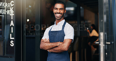 Arms crossed, coffee shop and portrait of happy man at door with smile, confidence and manager at restaurant startup. Bistro waiter, service industry and food, small business owner at cafe doorway.
