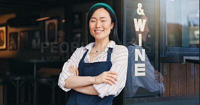 Happy asian woman, cafe and small business owner by door in confidence for management. Portrait of young female person or waitress smile with arms crossed by professional restaurant or coffee shop