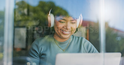 Woman, headphones and happy with laptop, remote work and streaming music playlist for online and internet. Creative, worker and network for freelance career, copywriter and working on social media campaign