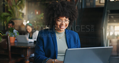 Woman, happy and cafe with laptop, remote work and typing for job, online and internet. Corporate outfit, journalist and technology for freelance career, copywriter and working on social media
