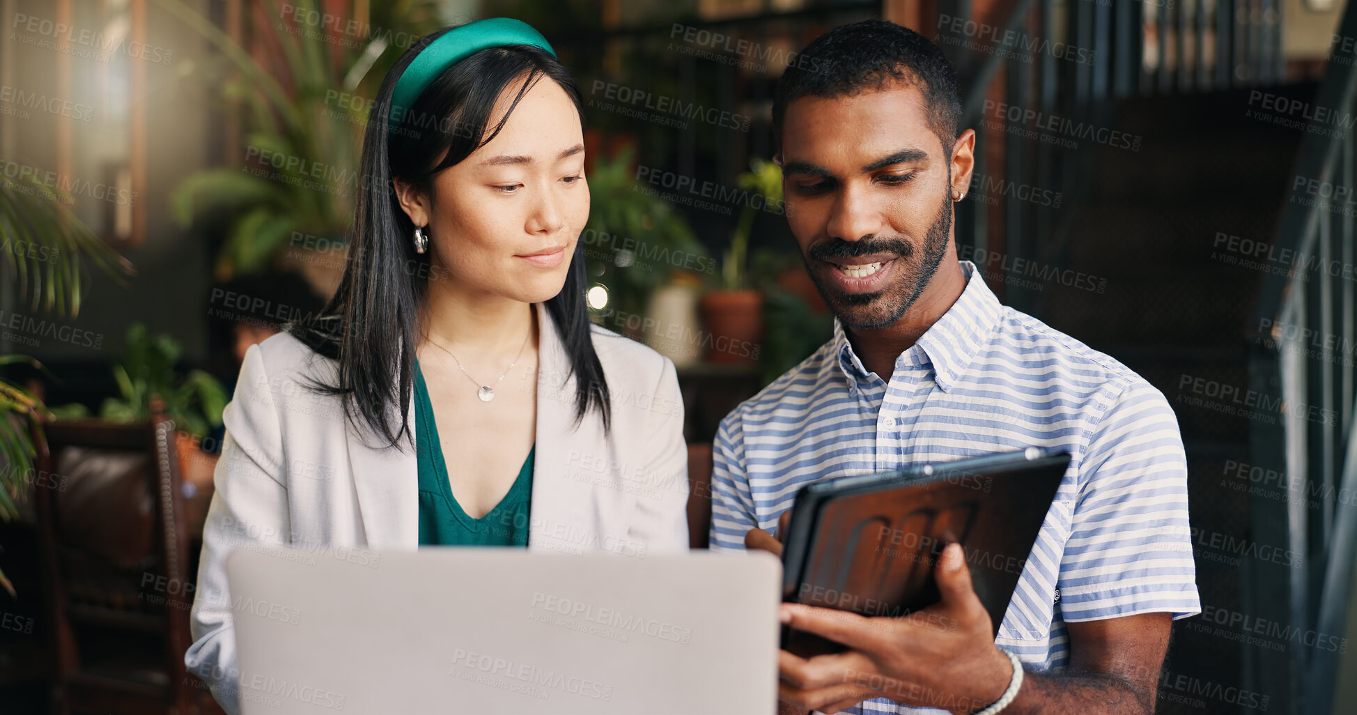 Buy stock photo Business people, laptop and tablet at cafe for research, schedule planning or design in creative startup. Happy man and woman working with technology on project, brainstorming or ideas at coffee shop