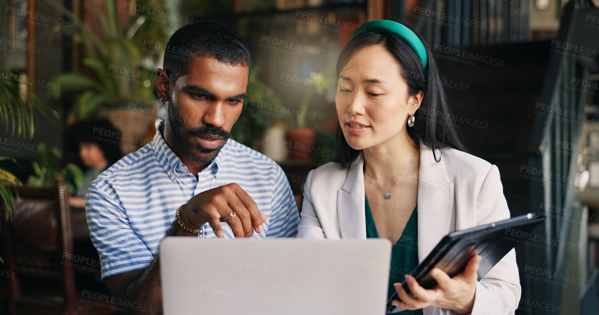 Buy stock photo Business people, laptop and tablet at cafe for research, schedule planning or design in creative startup. Happy man and woman working with technology on project, brainstorming or ideas at coffee shop