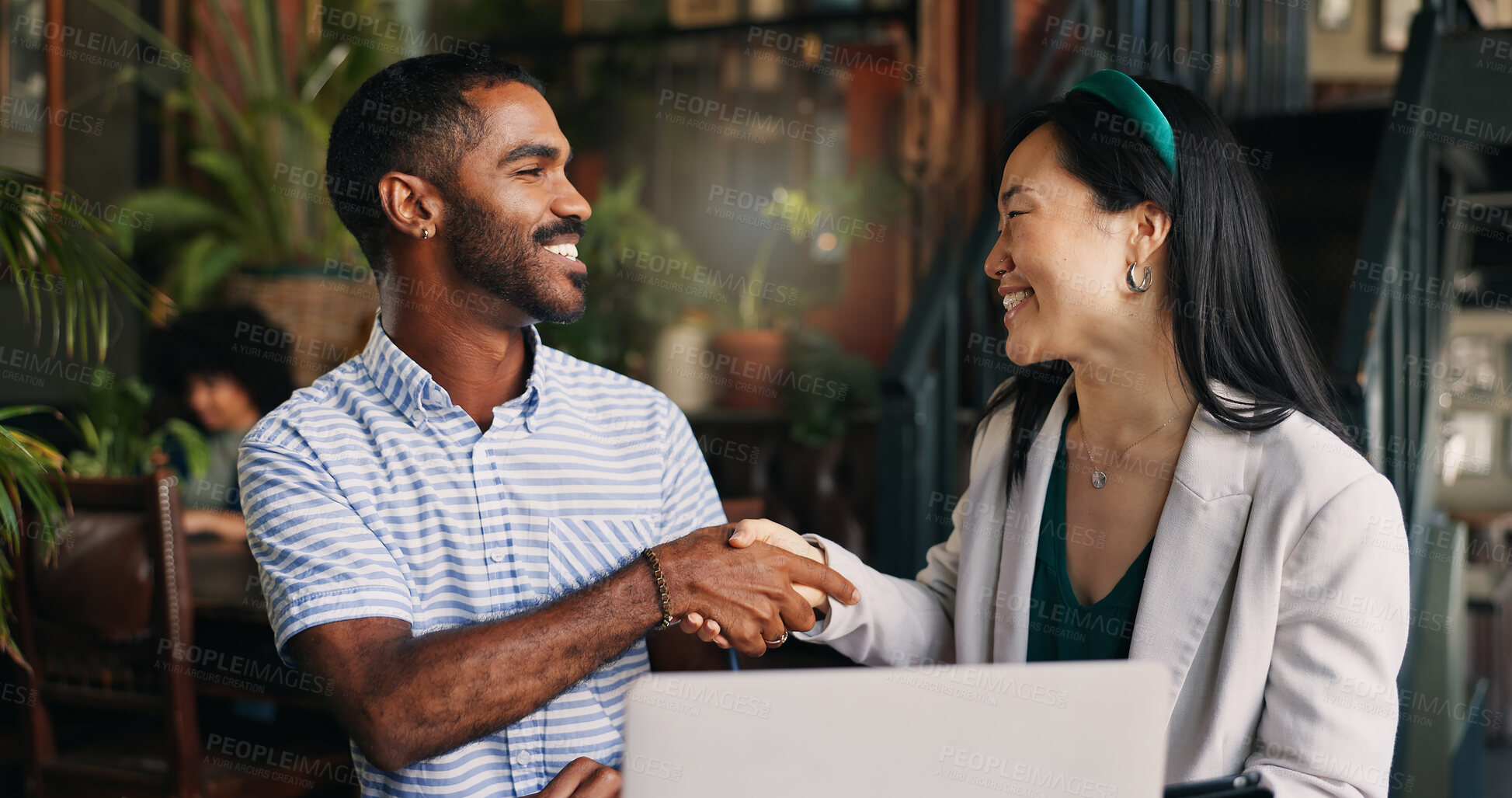 Buy stock photo Japanese business woman, man and handshake by laptop, talking and tablet with deal, advice and finance startup. Person, financial advisor and agreement with information, investing knowledge and chat