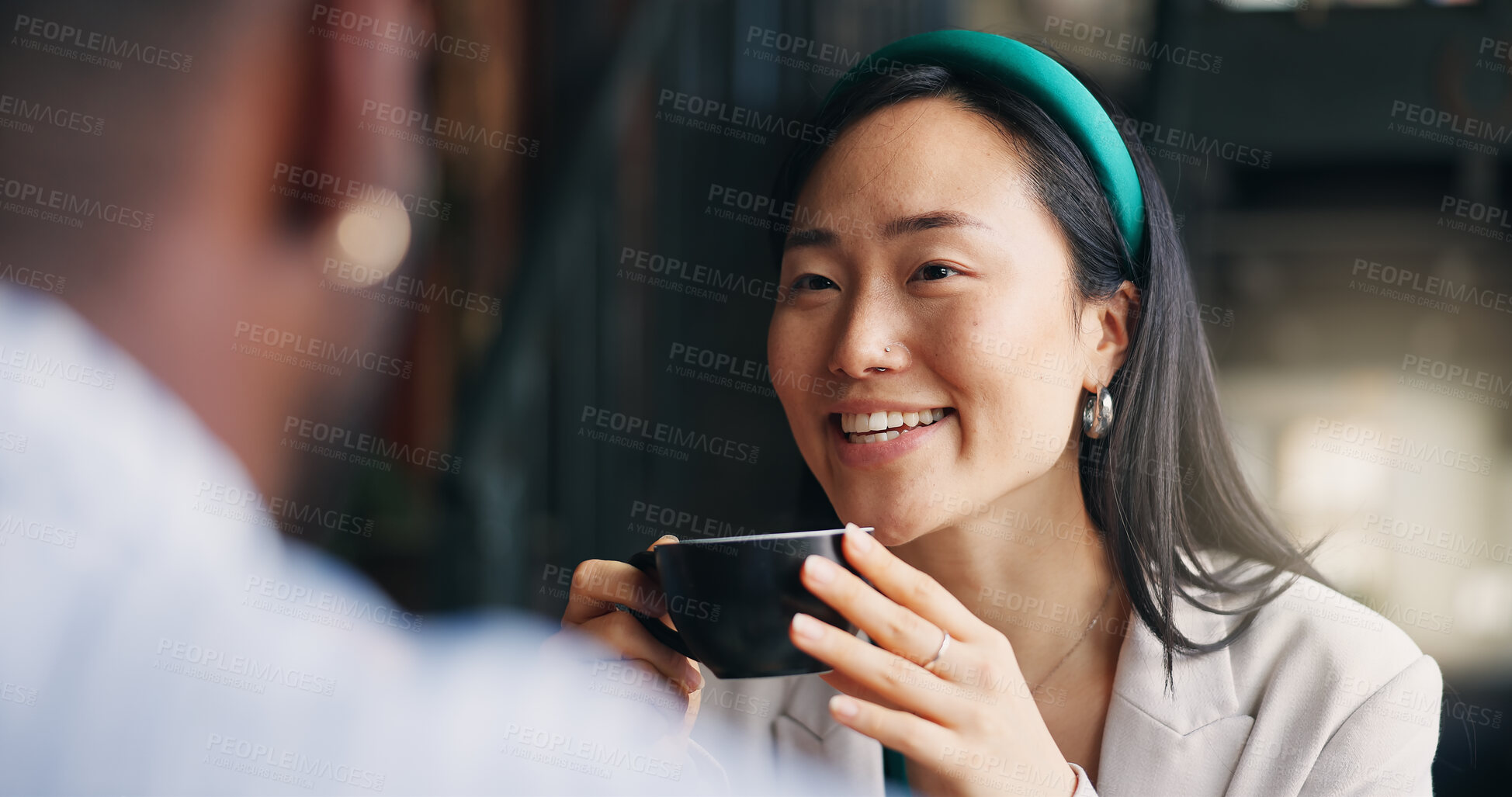 Buy stock photo Happy asian woman, friends and coffee at cafe for conversation, catch up or break together. Young female person talking to man with smile or cup of tea for friendly discussion at indoor restaurant