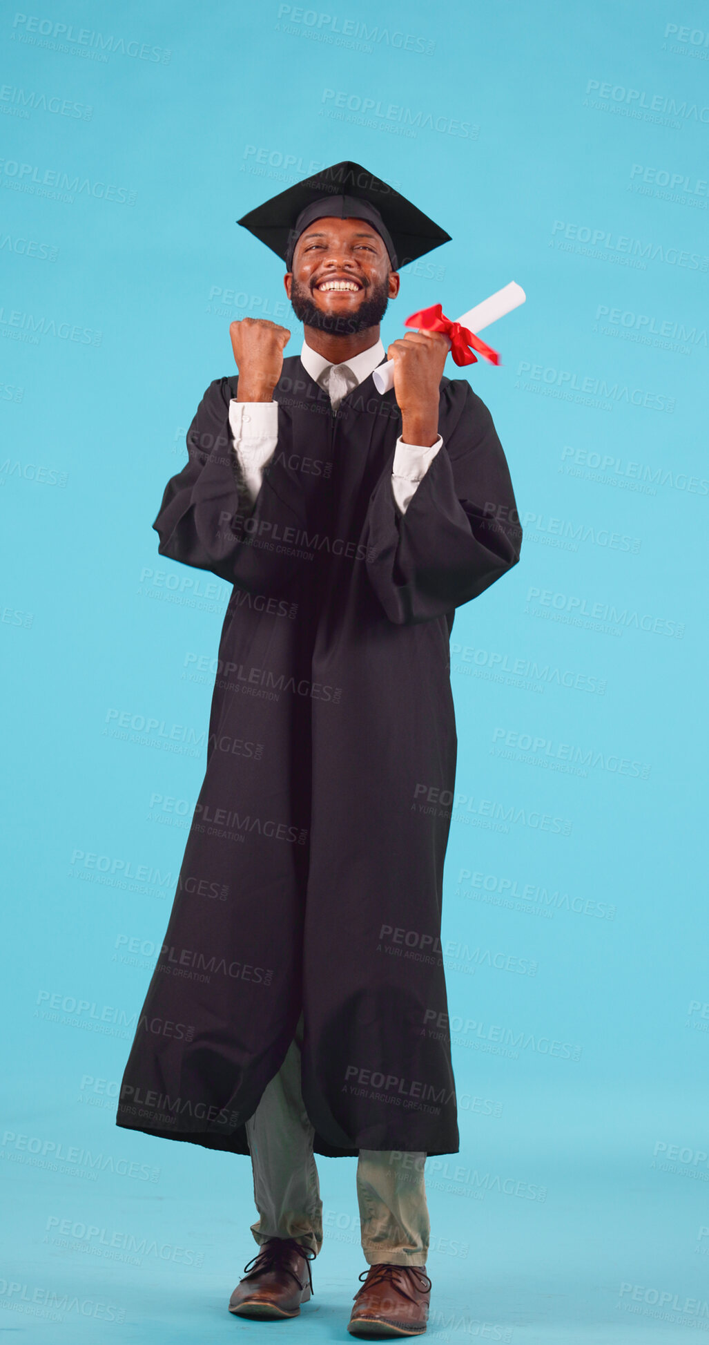 Buy stock photo Black man, graduation and education success with celebration, excited and happy with diploma on blue background. Goal, future and certified with academic win, ceremony and cap with gown in studio