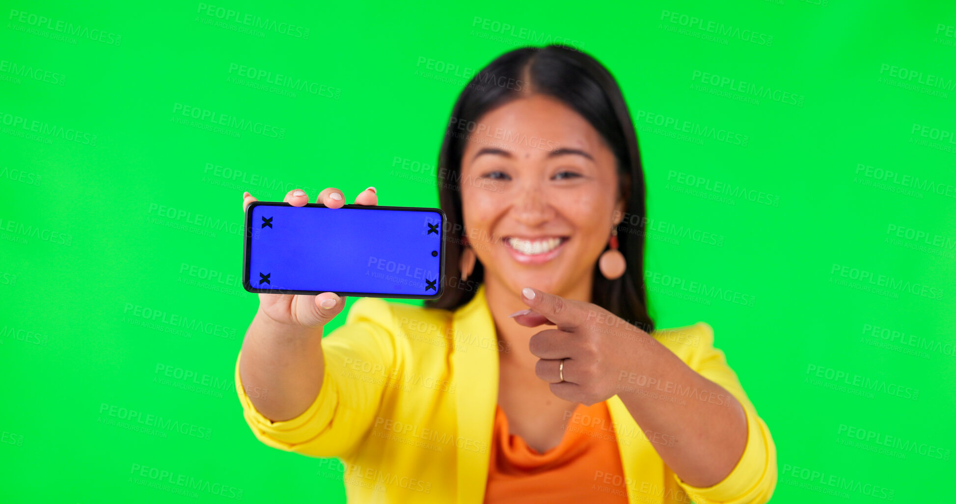 Buy stock photo Woman, green screen and hand pointing to mobile mockup space with tracking markers on studio background. Portrait, phone and asian lady showing product placement for news and how to steps for app