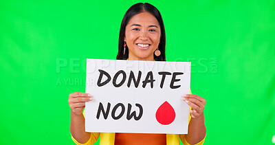 Buy stock photo Portrait of woman, billboard and blood donation on green screen for advertising against a studio background. Happy Asian female person with sign or poster in donate, healthcare or volunteer on mockup