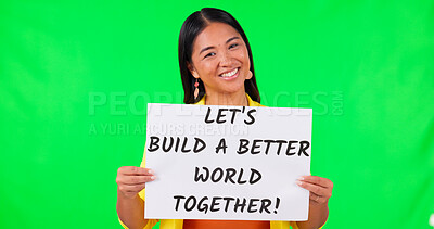 Poster, motivation and message with an asian woman on green screen background in studio for the future of the world. Portrait, sign and challenge with a happy young female person on chromakey mockup