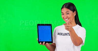 Buy stock photo Tablet, pointing and portrait of volunteer on green screen for donations, website and online sign up. Ngo, studio and Asian woman with hand sign on digital tech for charity, community service or help