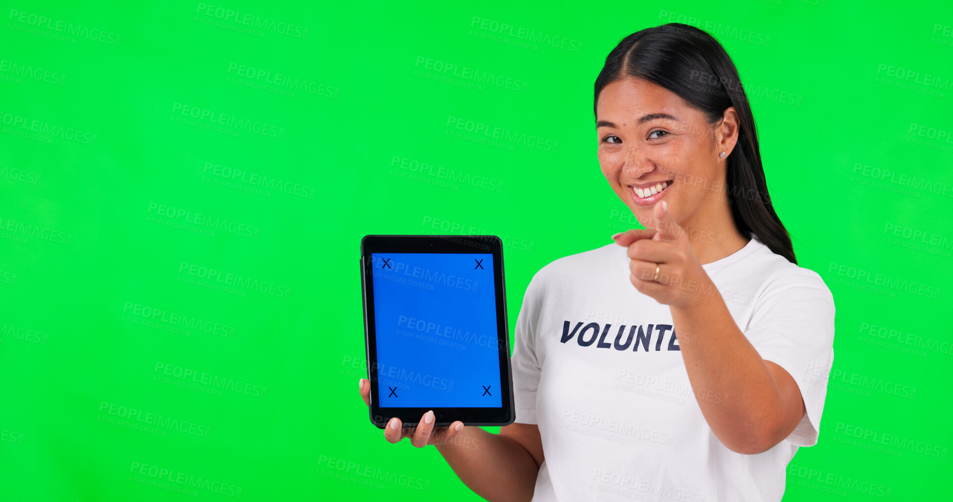 Buy stock photo Tablet, pointing and portrait of volunteer on green screen for donations, website and online sign up. Ngo, studio and Asian woman with hand sign on digital tech for charity, community service or help