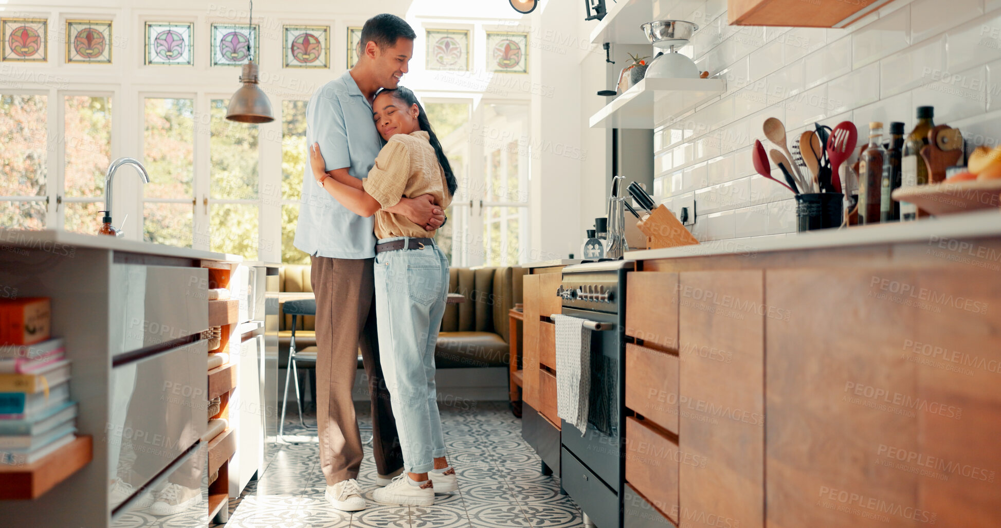 Buy stock photo Love, hugging and couple dance in kitchen at home with music, playlist or radio for romance. Happy, smile and young woman embracing, bonding and moving with man to album together at apartment.