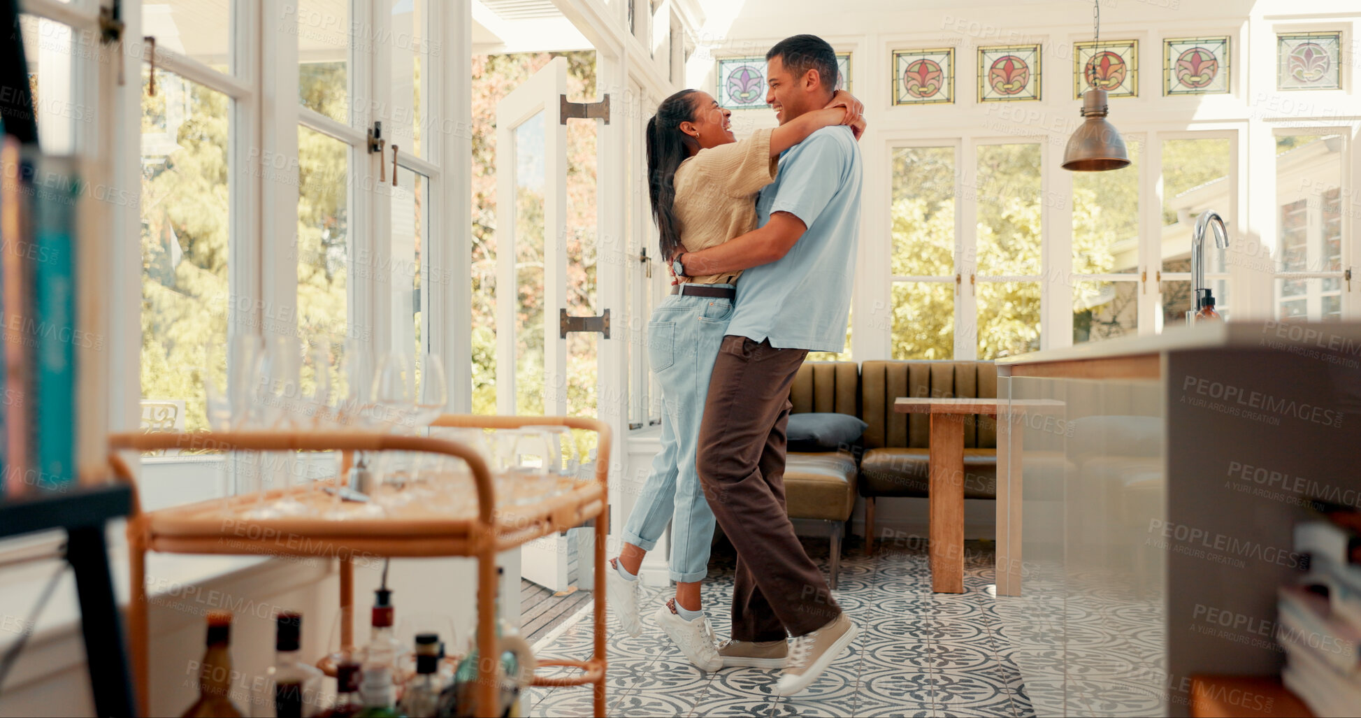 Buy stock photo Love, happy and couple dance in kitchen at home with music, playlist or radio for romance. Embracing, smile and young woman having fun, bonding and moving with man to album together at apartment.