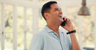 Laughing, conversation and a man on a phone call in a house for communication or funny chat. Happy, hello and a person speaking on a mobile for networking, discussion or talking to a contact in home