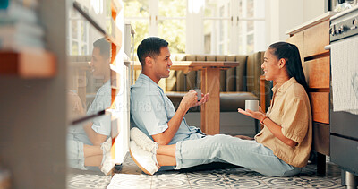 Coffee, talking and a happy couple at home with love, care and communication. Young woman and a man drinking tea together in an apartment to bond for happiness, quality time and commitment on a floor