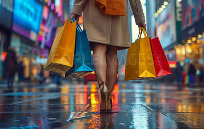 City, walking and legs of woman with shopping bag, color and style for retail therapy at night. Fashion, customer and discount sale at luxury boutique with designer shoes, clothes and urban street.