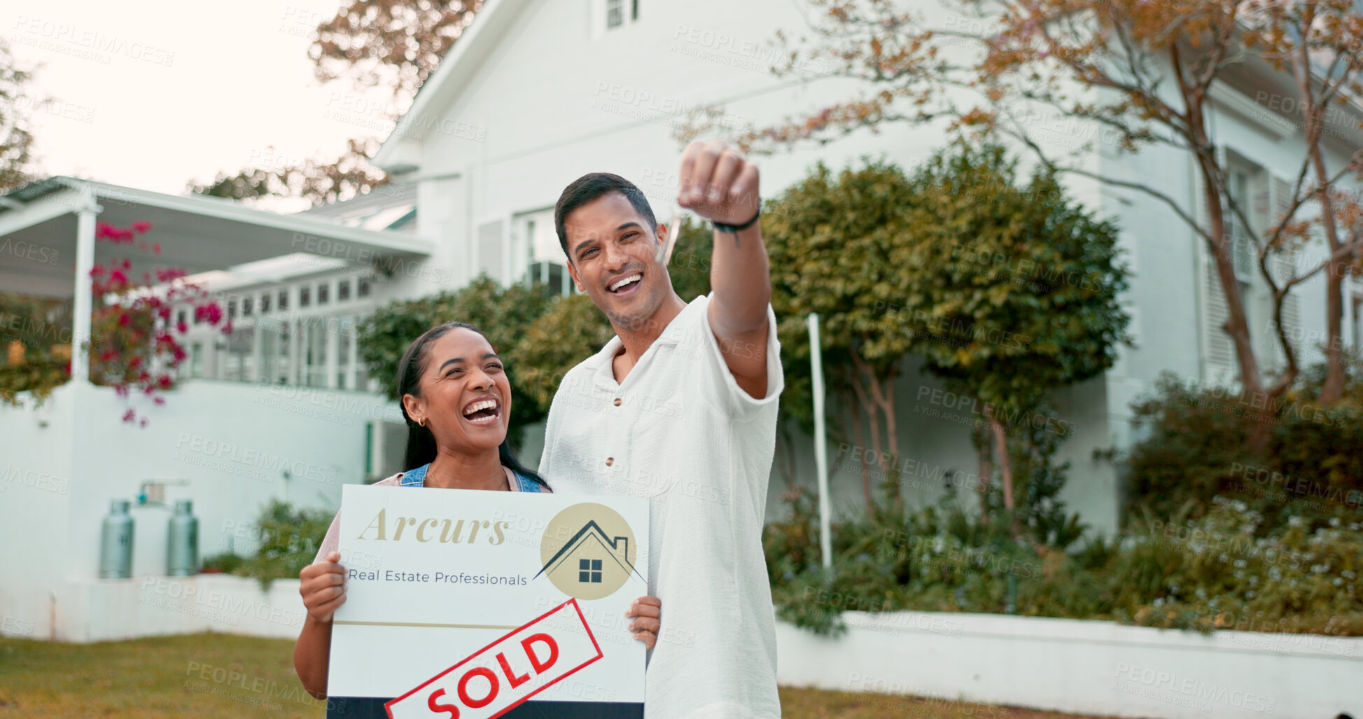 Buy stock photo Keys, portrait and couple with sold sign, new home and future property investment together. Love, mortgage and real estate, excited man and happy woman in garden at house with smile in neighborhood