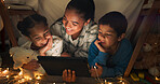 Funny, tablet and mother with children in a tent house streaming internet video, show or movie online in the night. Dark, digital and parent or dad relax with kids watching comedy in the evening