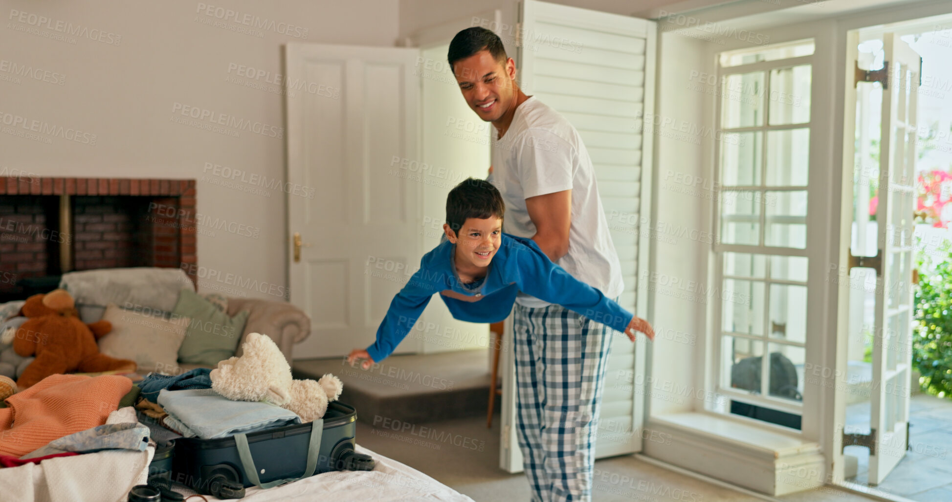 Buy stock photo Father, playing and airplane with his child in living room with bonding and kid in family home. Happy, smile and dad carrying an excited boy with game, love and support in a house in the morning