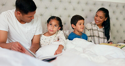 Mom, dad and happy kids in bedroom with reading book, teaching and fun learning in family home. Happiness, fantasy and parents relax on bed with laughing children, love and funny storytelling time.