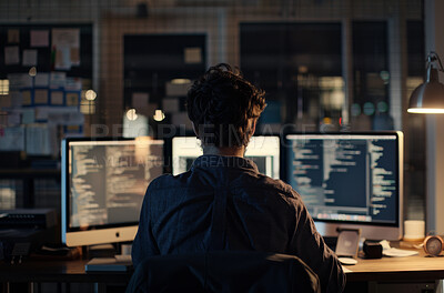 Man, computer and software in office at night, programmer and cybersecurity for startup company. Male person, back and writing code on website or app, data analytics and internet for cpu system