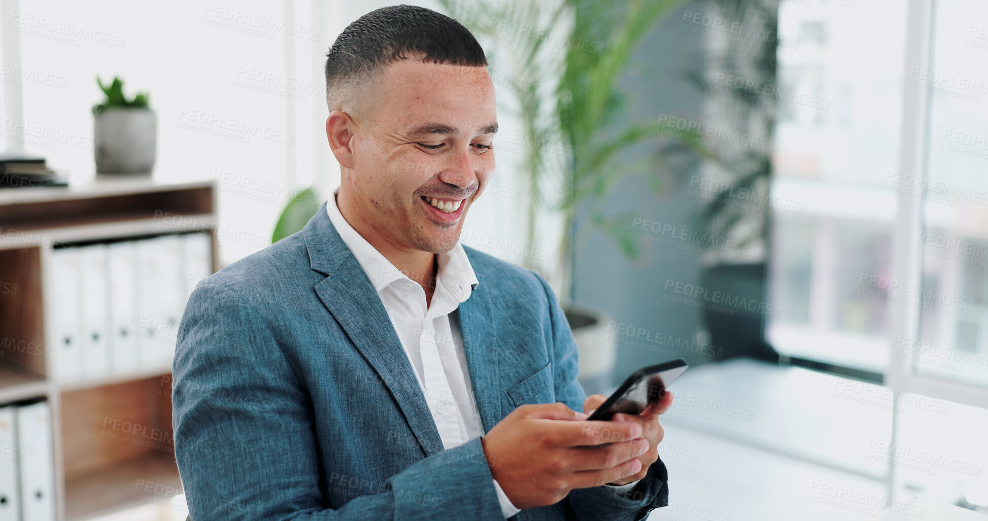 Buy stock photo Businessman, cellphone and video call in office for communication, laughing and networking in online forum. Hr consultant, relax or break for talking on smartphone, greeting or positive in workplace