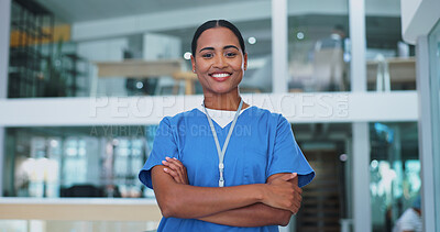 Surgeon, woman and arms crossed with face, smile and pride for career in healthcare at hospital. Doctor, nurse and person with confidence for wellness in clinic lobby for medical job in Costa Rica