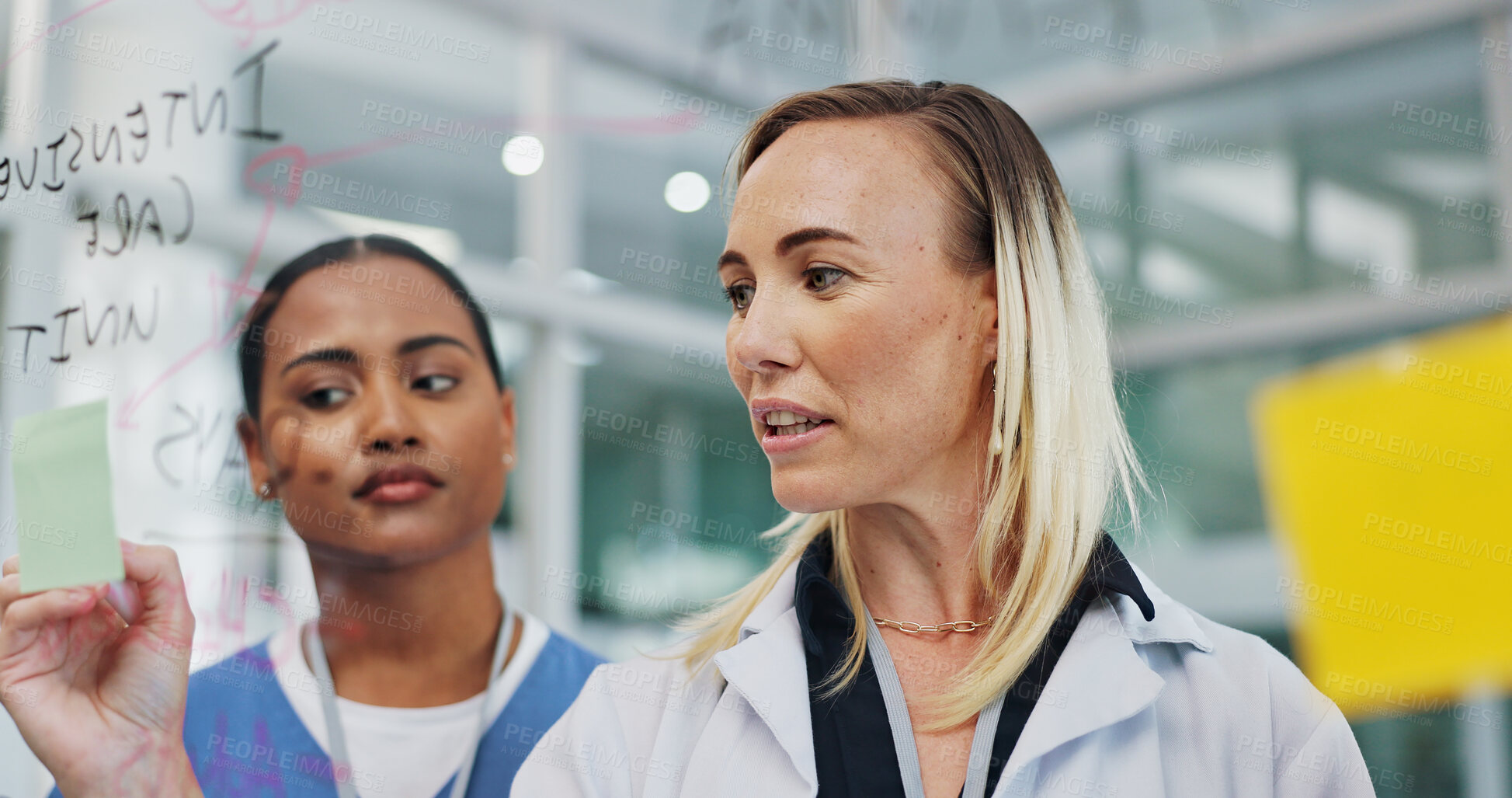 Buy stock photo Doctor, women and hospital with planning for teamwork, collaboration and employee training with mentor. Support, help and learning with glass board for career, progress and performance review