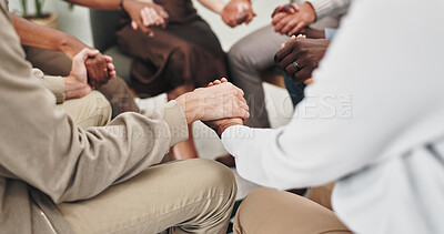 People, holding hands and together at group therapy with support, above or kindness for mental health. Huddle, scrum and empathy with compassion, help and psychology with trust, circle or community
