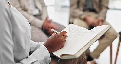 Therapist, hands and writing notes for consulting with group in closeup, support and helping for mental health. Psychologist, pen and notebook for review, feedback or patient with community in clinic
