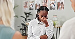 Woman, crying and talking in group therapy with support, anxiety and sharing story for mental health. People, psychology and sad African patient with stress, depression or tears in circle for empathy