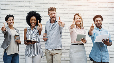 Buy stock photo Business people, portrait and thumbs up for office interview  at brick wall with technology, networking or recruitment. Men, women and diversity in line or positive gesture, opportunity or teamwork