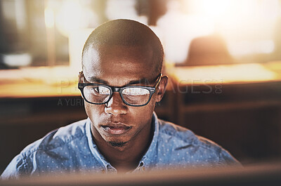 Buy stock photo Serious businessman, glasses and night with computer for project deadline, design or research at office. Face of young man, designer or employee working late on PC for web development at workplace