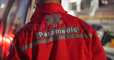Back, man and paramedic walking to ambulance for emergency, ems service and healthcare in city. Rear view, medical professional and doctor outdoor at night for first aid, rescue operation and work