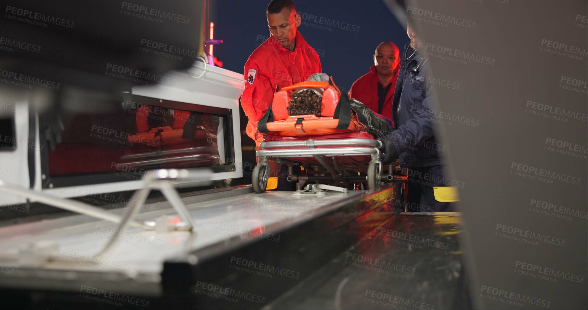 Buy stock photo Ambulance, first aid and accident with a paramedic team on scene to rescue a person at night. Healthcare, medical and emergency with emt services on the street for urgent or professional medicare