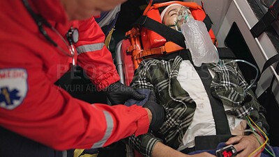 Patient, paramedic and blood pressure with oxygen mask in ambulance for emergency, injury or healthcare with neck brace. First responder, person and anesthesia for medical health, support or victim